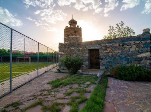 Stone watchtower at sunset on the farm